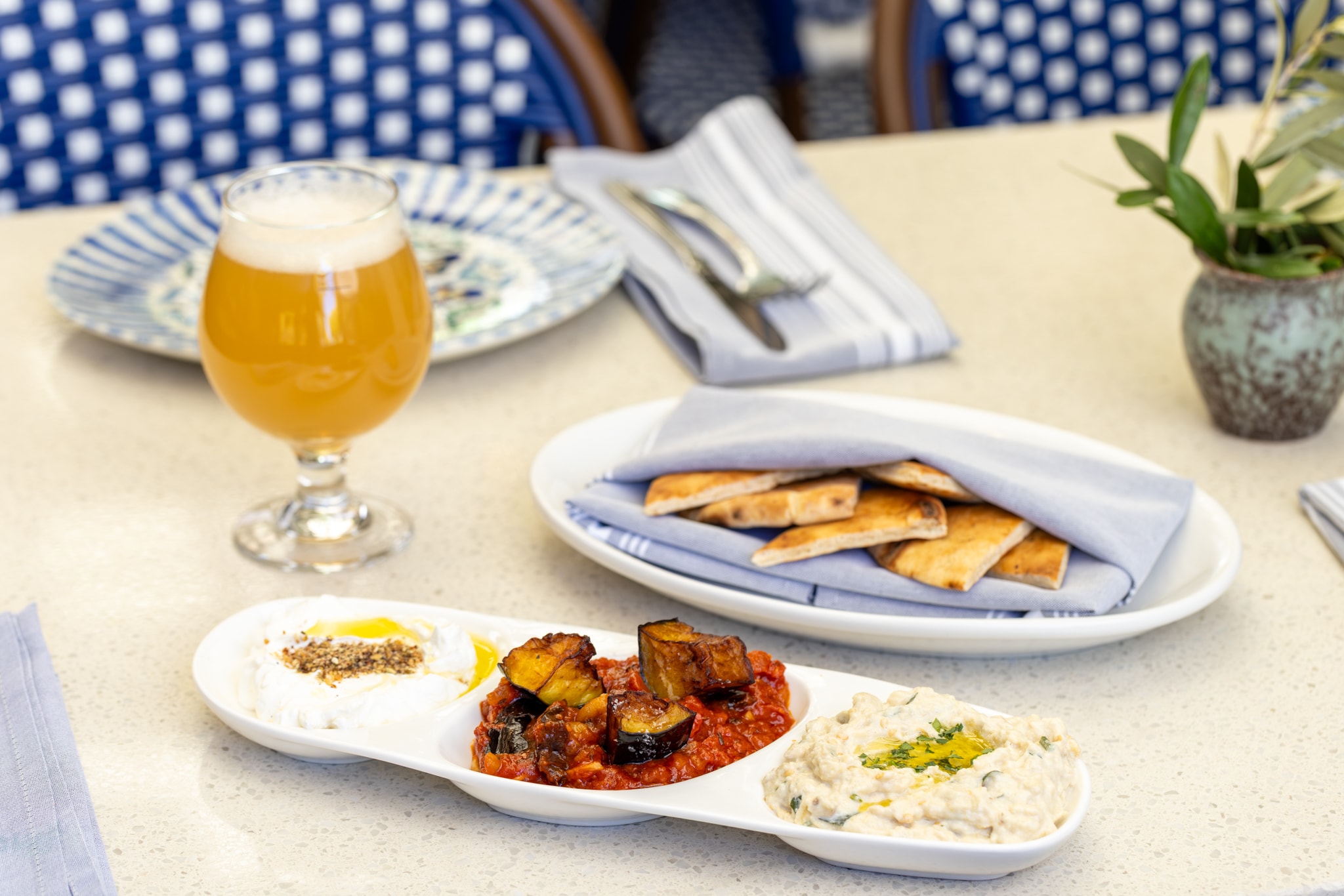 Maza trio with eggplant, roasted pepper, and baba ghanoush with beer