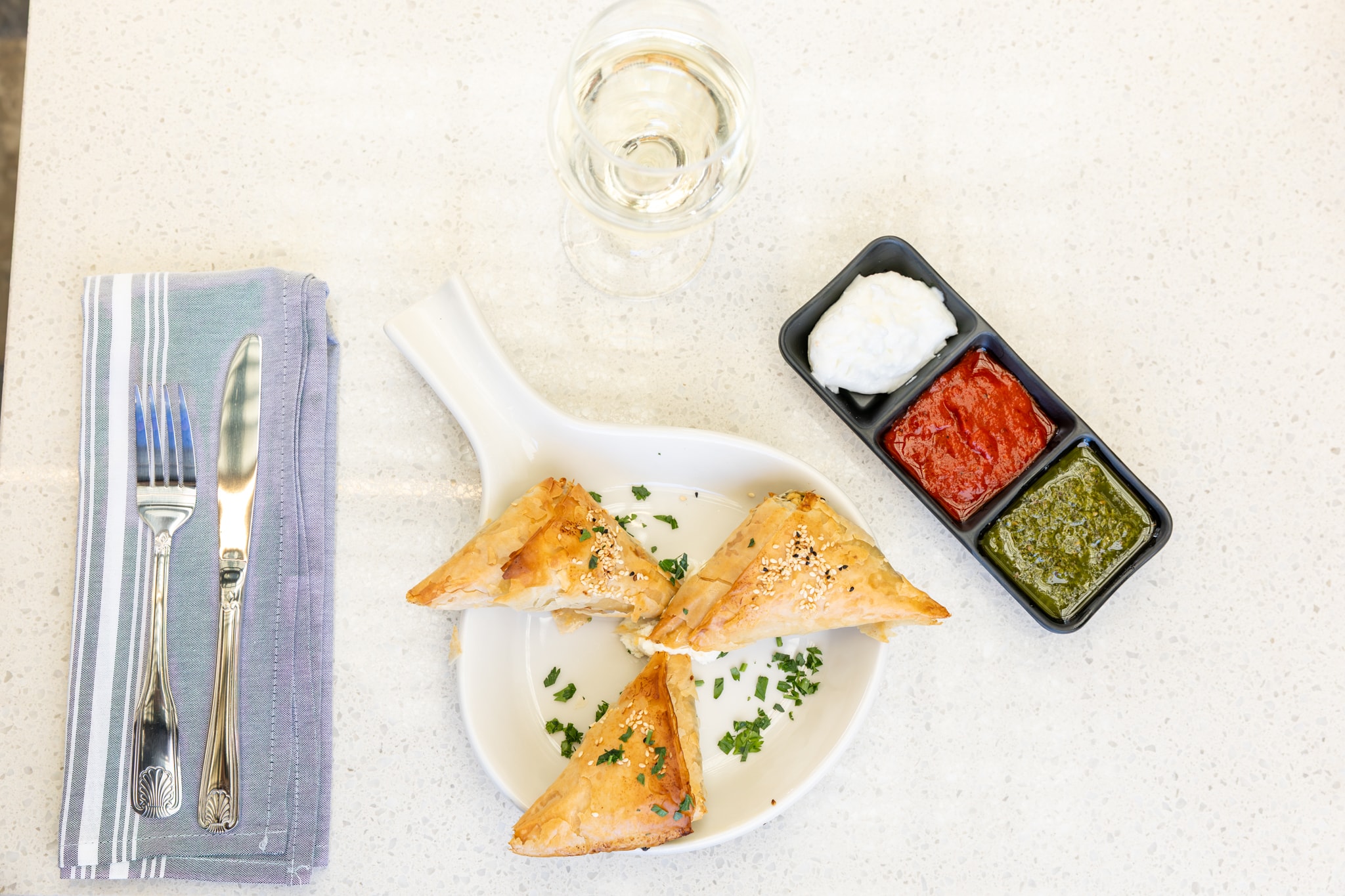Phyllo pastry triangles with three dipping sauces