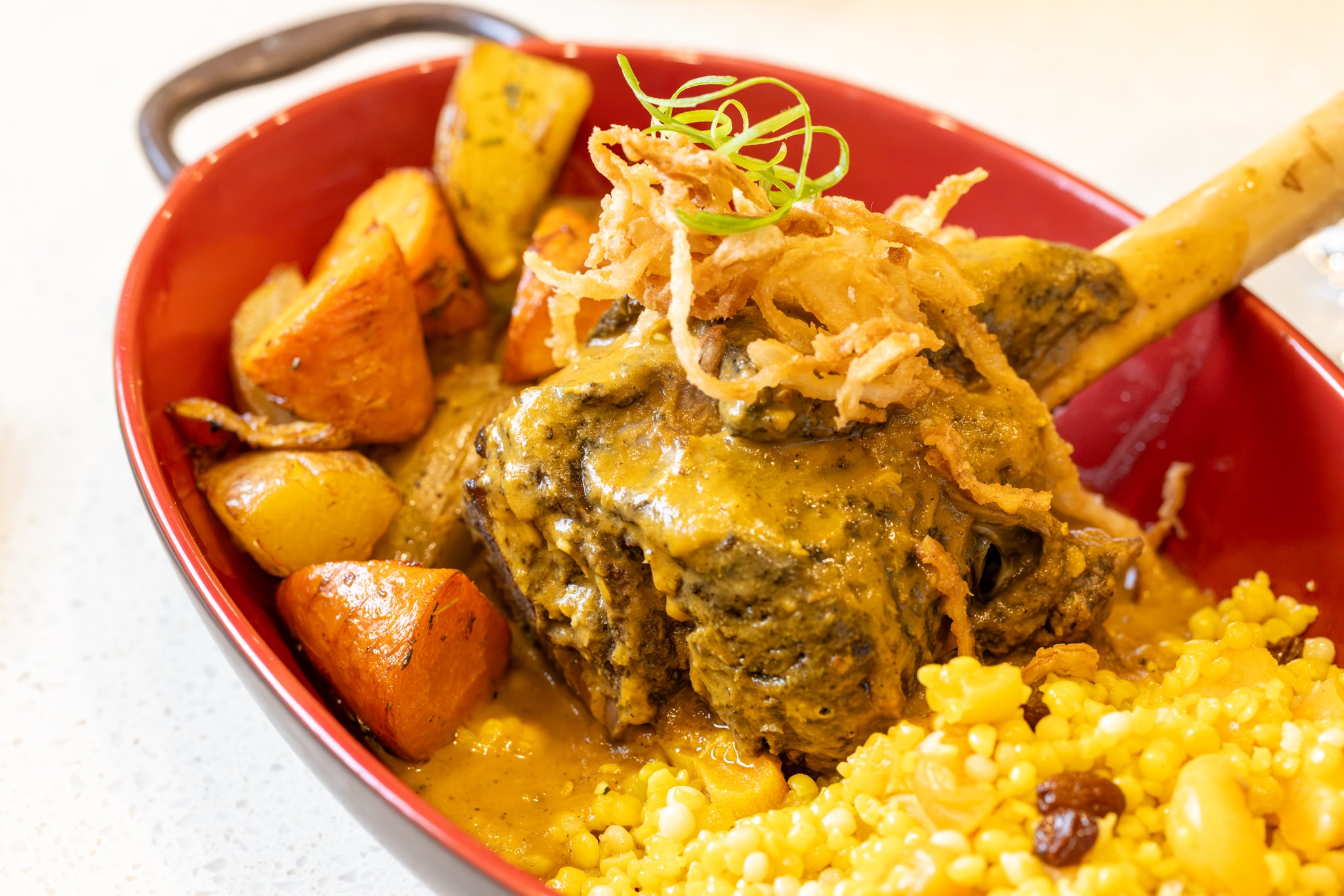 Lamb shank tagine with saffron couscous and roasted vegetables
