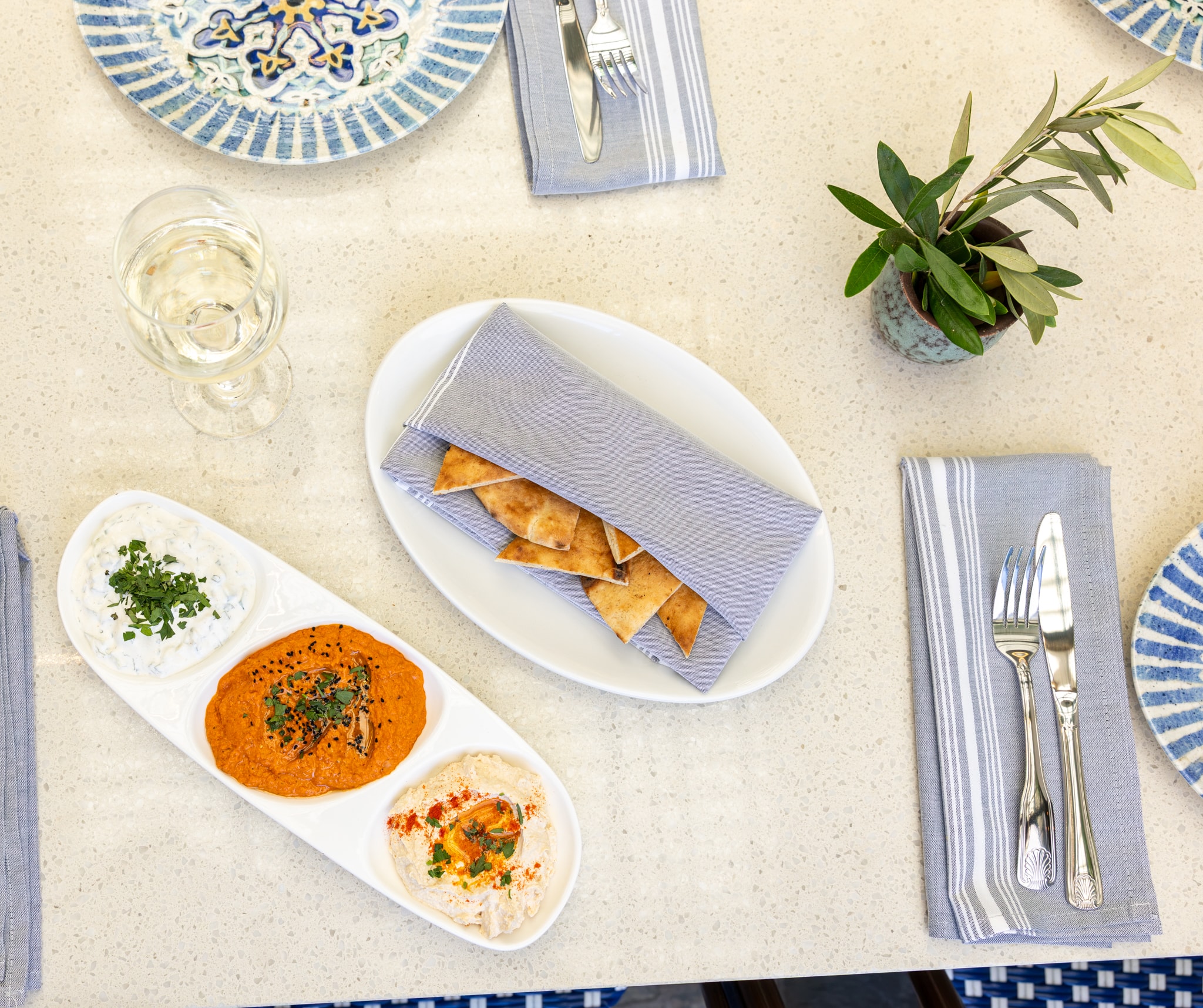 Maza trio with labneh, muhammara, and hummus with pita